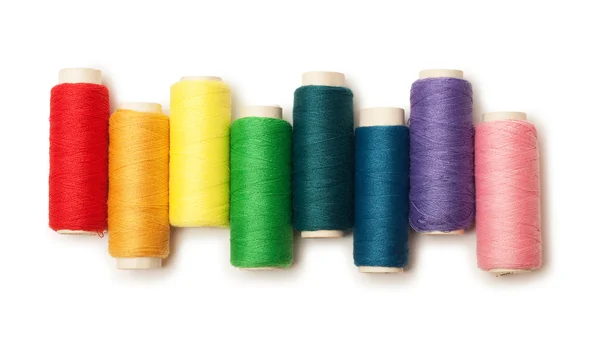 Rainbow colored set of threads isolated over white — Stock Photo, Image
