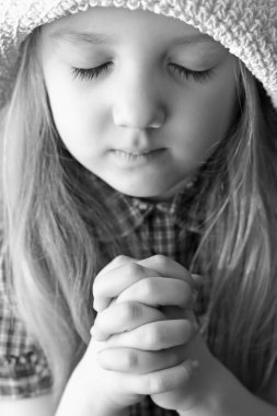 Portrait of a praying girl clipart