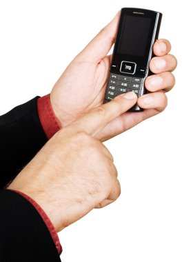 Businessman's hand holding a cell phone clipart