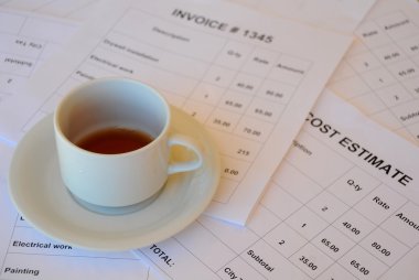 Cup of Tea on Financial Documents clipart