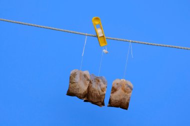 Tea Bags on the Rope in the Sun clipart
