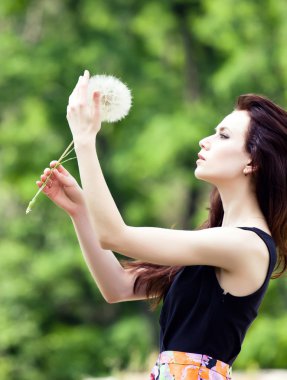 Girl and dandelion clipart