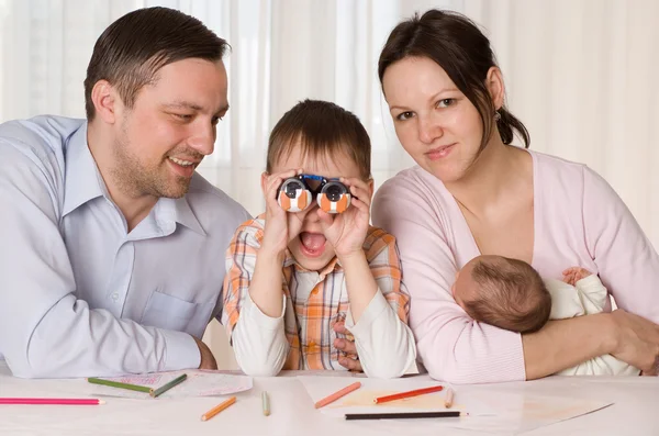 Family sitting at the table — Stock Photo, Image