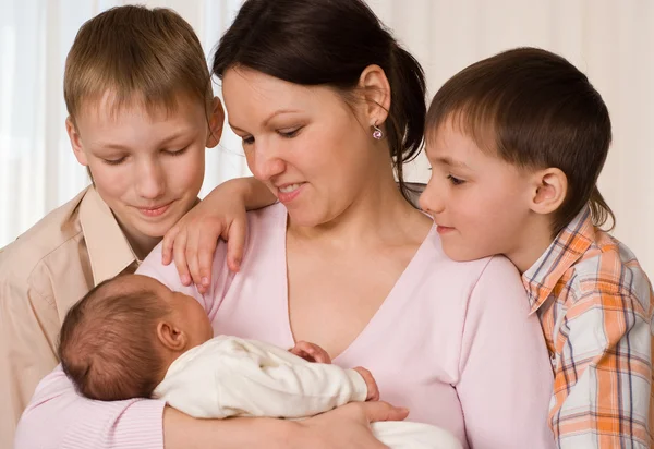 Young mother with three kids — Stock Photo, Image
