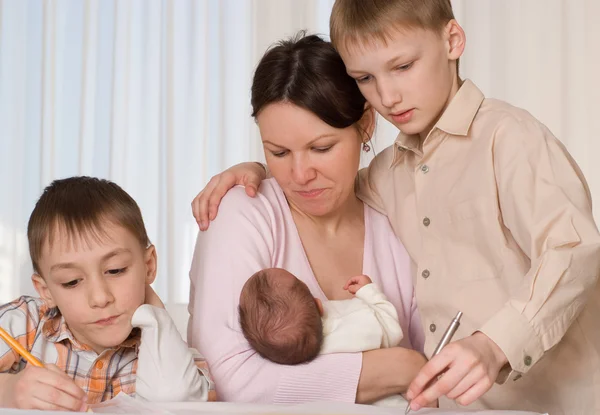 Young mother with three kids — Stock Photo, Image