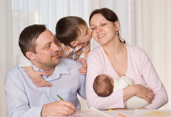 Happy couple with two children — Stock Photo, Image