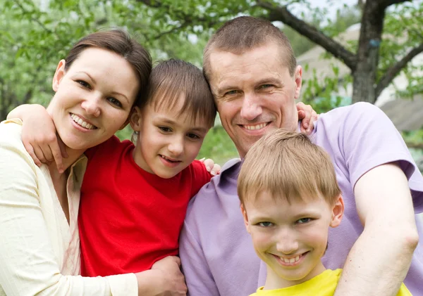 Happy boys with family in the summer park — Stock Photo, Image