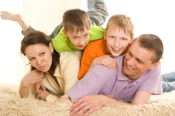 Family on a light background — Stock Photo, Image