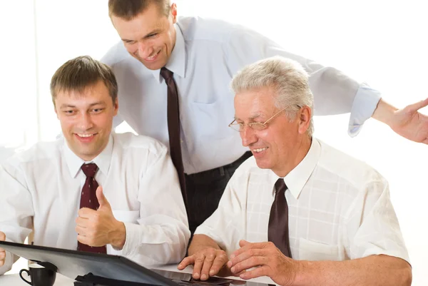 Businessmen working at a table — Stock Photo, Image