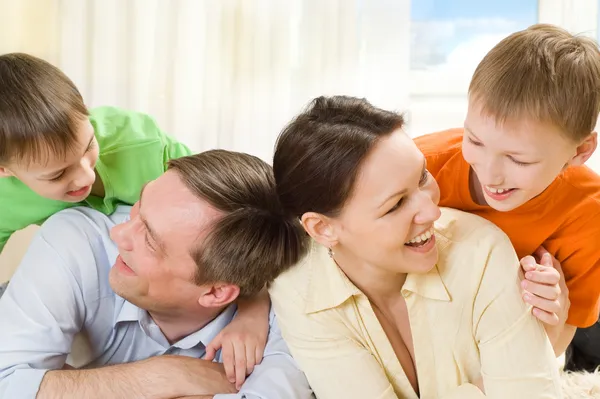 Parents a to play with his sons Stock Image