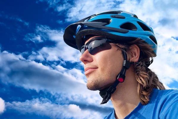 Portrait of a young bicyclist in helmet — Stock Photo, Image