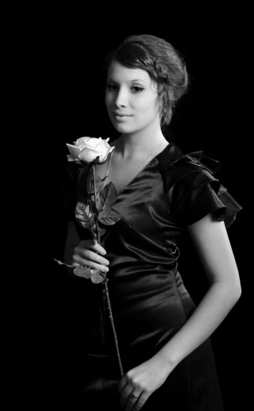 Menina agradável com uma rosa — Fotografia de Stock