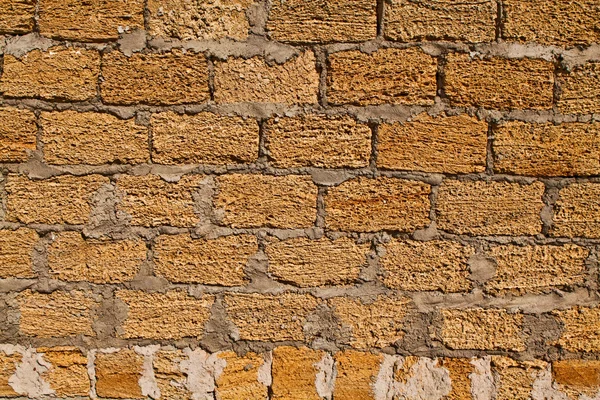 Geschrobd bakstenen muur — Stockfoto