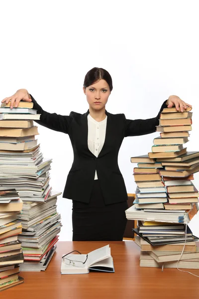 Girl and two large piles of books — Stock Photo, Image
