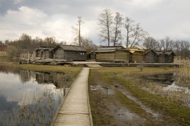 Ancient wooden houses in Latvia clipart