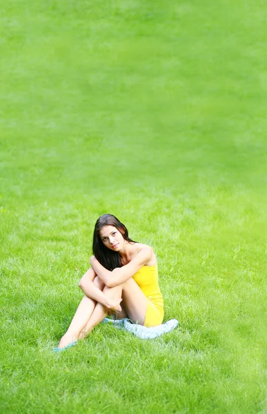 Sexy brunette on grass — Stock Photo, Image