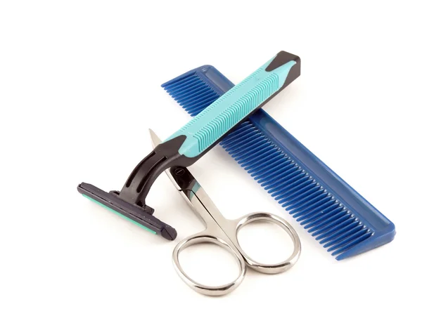 Razor, scissors and comb Stock Photo