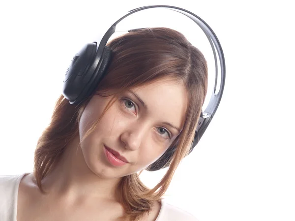 Młoda kobieta ze słuchawkami — Zdjęcie stockowe
