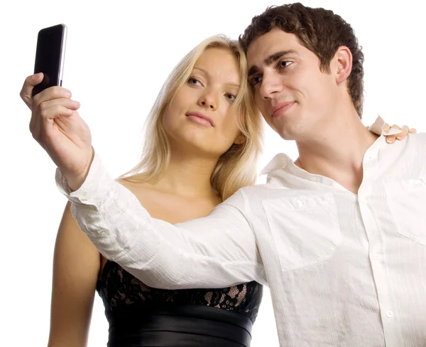 Νεαρό ζευγάρι με κινητό τηλέφωνο Εικόνα Αρχείου