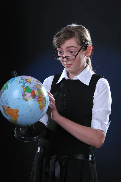 Schoolgirl and globe — Stock Photo, Image