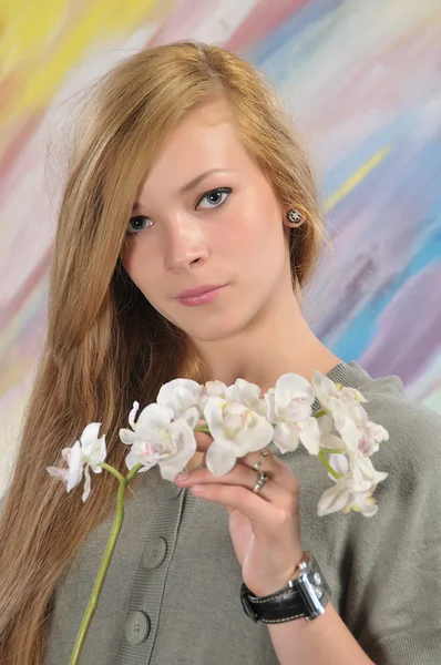 Portrait of beautiful girl with white orchid — Stock Photo, Image