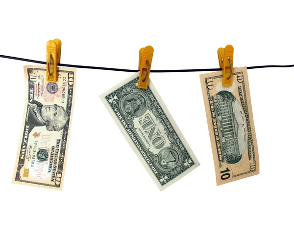 Dollars hängen an Wäscheklammern — Stockfoto