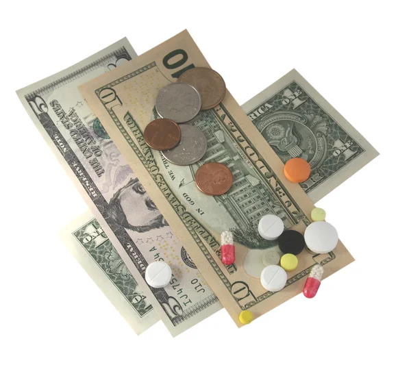 Geld en tabletten — Stockfoto