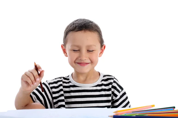 Junge mit Bleistiften isoliert auf weiß — Stockfoto