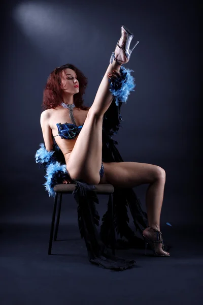 Modern strip dancer in chair — Stock Photo, Image