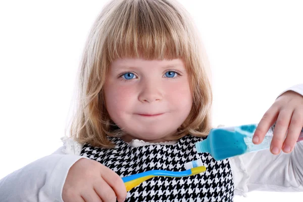 Kleines Mädchen mit Zahnbürsten — Stockfoto