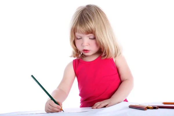 Menina com lápis ao lado da mesa — Fotografia de Stock