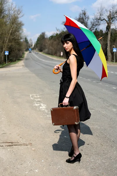 Hitch-hike girl with vintage suitcase — Stock Photo, Image