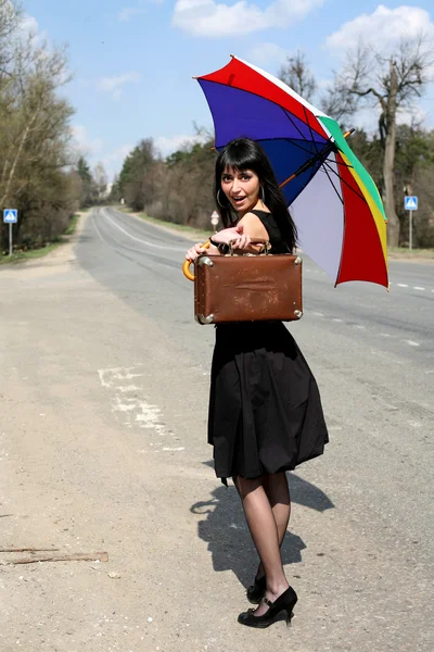 Hitch-hike girl with vintage suitcase — Stock Photo, Image