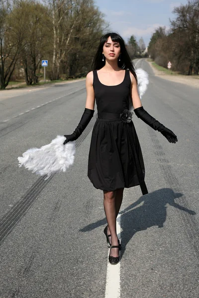 Angel in the road with broken wing — Stock Photo, Image