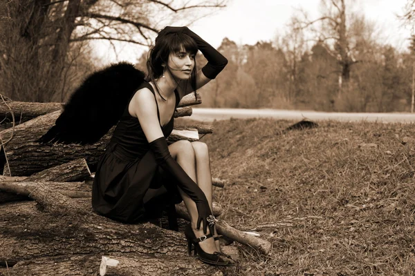 Black angel outdoors — Stock Photo, Image