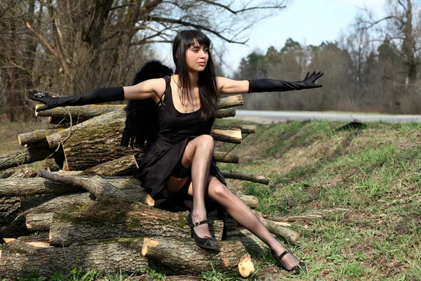 Black angel outdoors — Stock Photo, Image