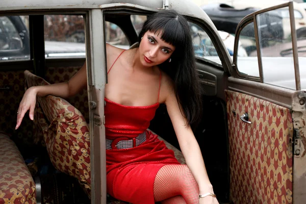 Girl inside retro car — Stock Photo, Image