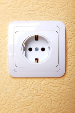 Electric plug connector in wall clipart