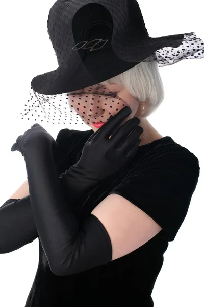 Lovely woman in hat hiding at veil — Stock Photo, Image