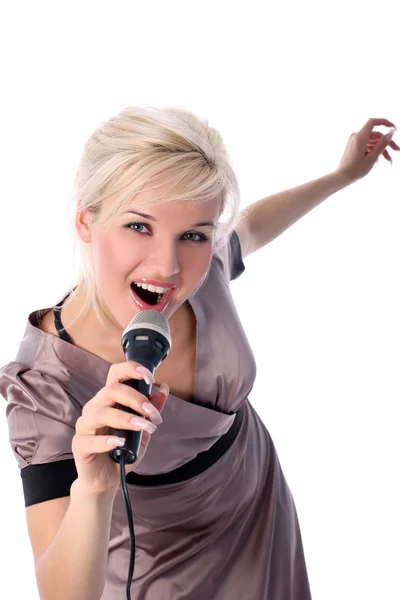 Blondine mit Mikrofon isoliert in Weiß — Stockfoto