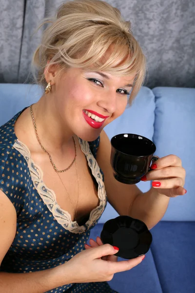 Woman with cup of hot drink — Stock Photo, Image