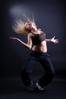 Young woman modern dancer in action clipart