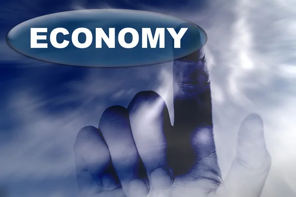 Hand en knop met woord van economie — Stockfoto