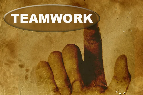 Hand met teamwerk knop — Stockfoto