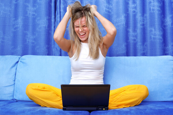 Crisis stressed woman at sofa