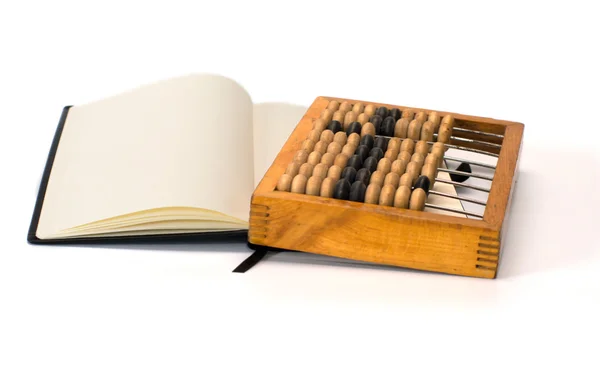 Abacus and notebook. — Stock Photo, Image