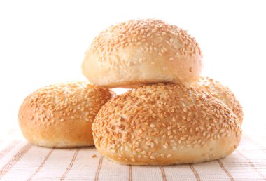 Four buns with sesame seeds clipart