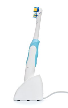 Electric toothbrush on stand clipart