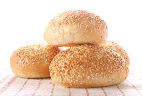 Quatro pães com sementes de sésamo — Fotografia de Stock