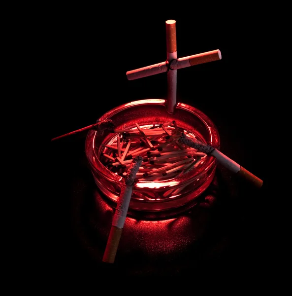 Cigarette cross in ashtray — Stock Photo, Image